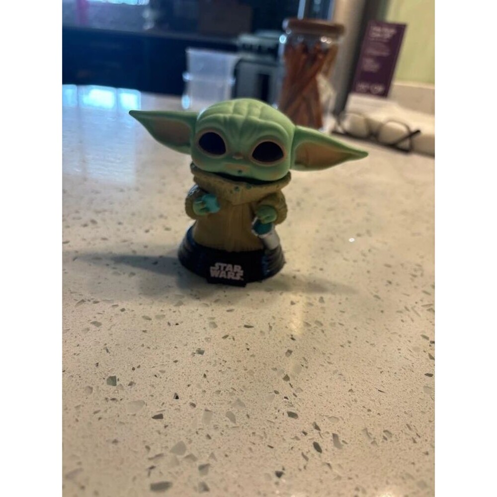 grogu the child eating a cookie star wars funko pop
